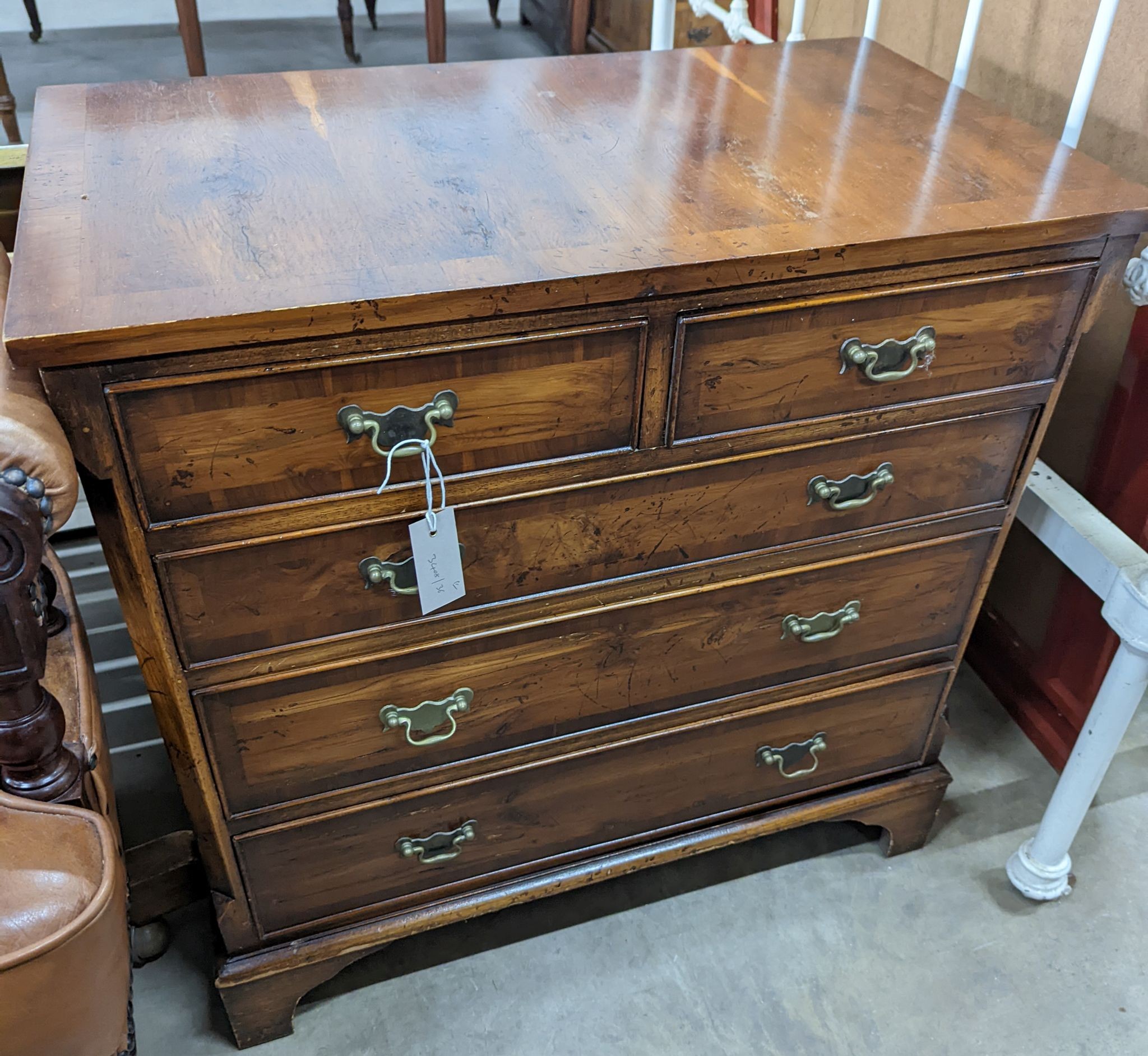 A pair of reproduction George III style yew chests, width 75cm, depth 43cm, height 74cm